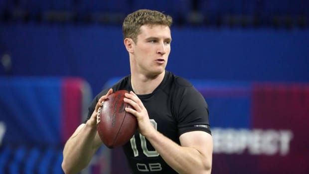 Mar 4, 2022; Indianapolis, IN, USA; Brown Bears quarterback E J Perry (EJ Perry) throws the ball during the 2022 NFL Scouting Combine at Lucas Oil Stadium. Mandatory Credit: Kirby Lee-USA TODAY Sports